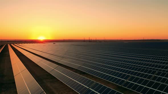 Aerial View of a Massive Solar Power Facility Located in a Field