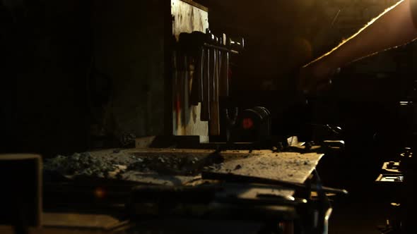 Hand of blacksmith working on a iron rod