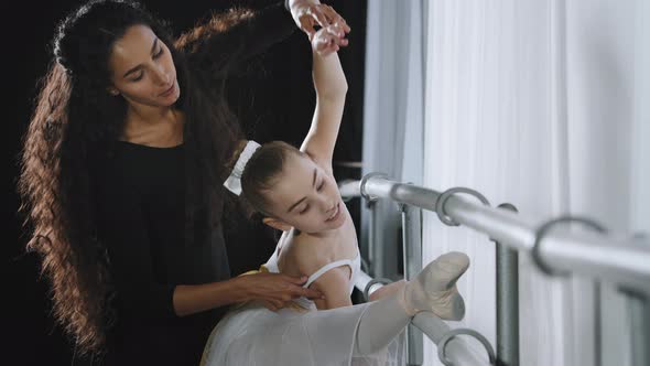 Adult Female Woman Teacher Trainer Dancer Helps Teaches Teenager Girl Ballerina Student Ballet alt