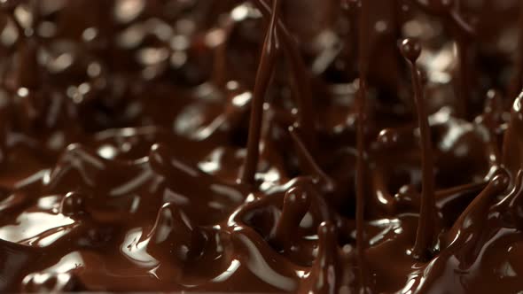 Super Slow Motion Detail Shot of Splashing Melted Chocolate at 1000 Fps