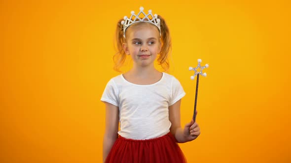 Funny Girl in Fairy Outfit Making Movement With Magic Wand Pretend Princess