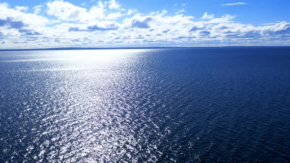 Flight over the ocean. Aerial ocean view. Top fly over the sea.	