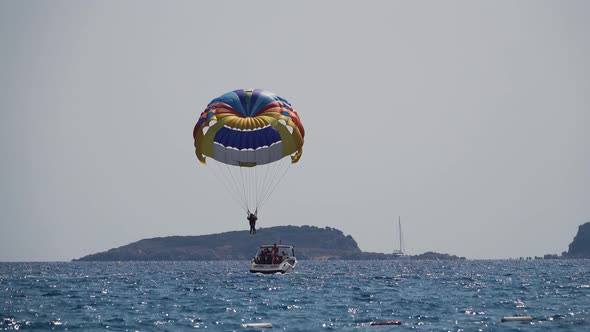 Parasailing Going Down to  Boat 