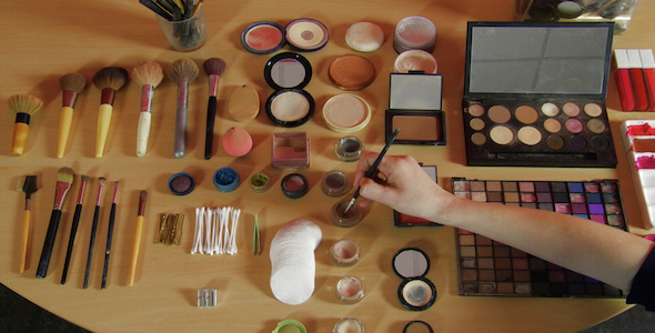 Dipping Brush into a Makeup Pot