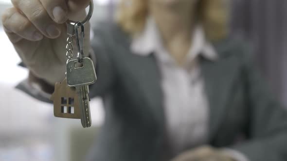 Senior Estate Agent Midsection Showing House Keys