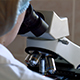 Doctor Scientist Viewing Through Microscope - VideoHive Item for Sale