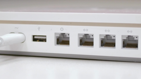 Plug In  Ethernet Cable In White Router