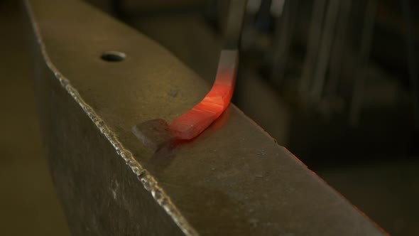 Blacksmith Working Metal With Hammer