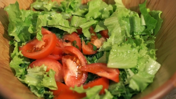 Stir Vegetable Salad a Wooden Scapula In The Kitchen