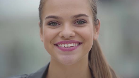 Close-up Portrait of Carefree Confidence Happy Girl Looking at Camera Outdoors