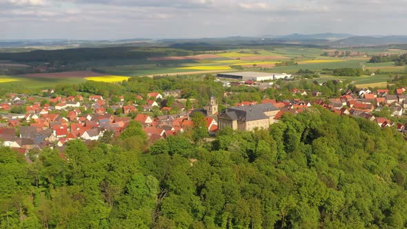 Drone flight over the town centre of Diemelstadt Rhoden in Germany with historical castle