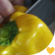 Chef Cutting Yellow Pepper on Kitchen Table - VideoHive Item for Sale
