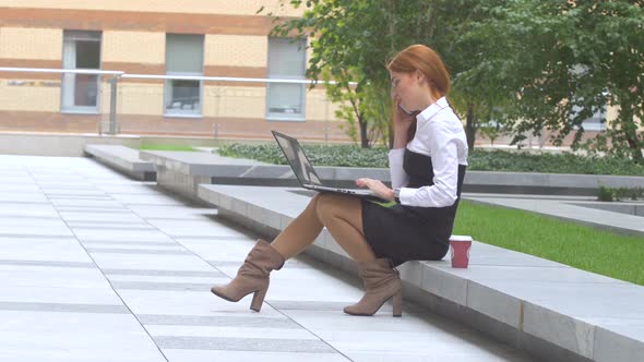 Woman Working on Laptop Computer on the Terrace, Cup of Coffee