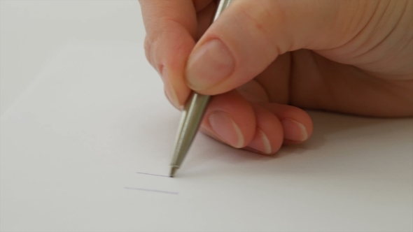 Female Hand Writes "I Love You" On The Paper Sheet