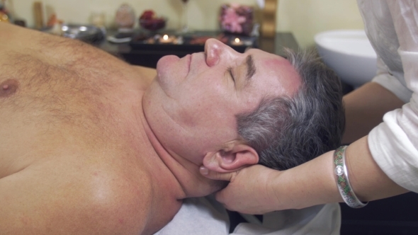 Masseuse Hands Make Healing Massage Of Head To Adult Fat Man. 