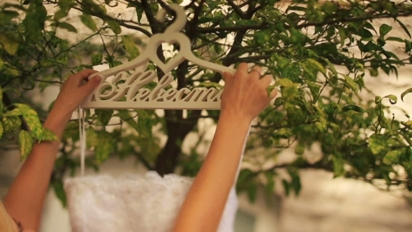 Blond Bride Trying On Her White Wedding Dress