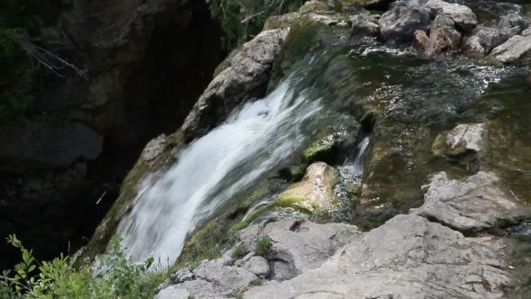 Big Beautiful Waterfall Flows Down The Rocks