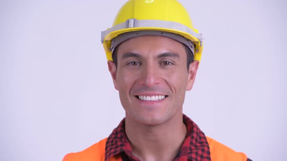 Face of Young Happy Hispanic Man Construction Worker Smiling