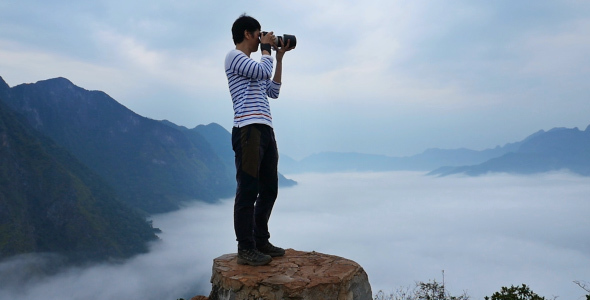 Photographer On The Top Of Mountain