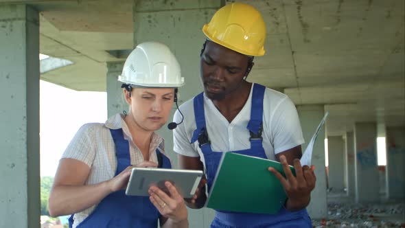 Construction Team Consult and Consider Plans for the Construction alt