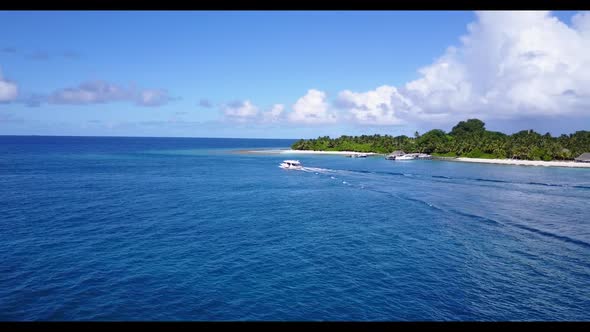 Aerial panorama of relaxing shore beach trip by turquoise lagoon and white sand background of a dayo