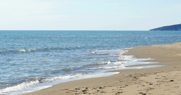 Little Girl Running On The Beach