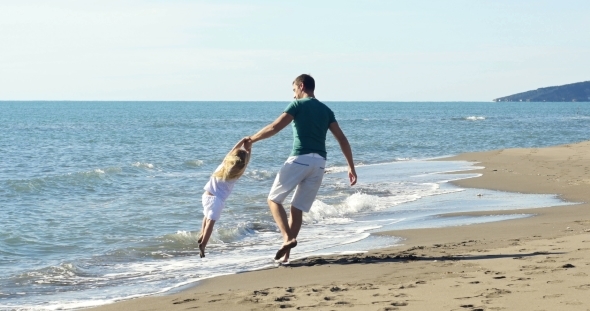 Dad Holding Daughter's Hands And Circling 