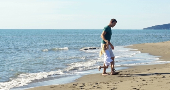 Dad Holding Daughter's Hands And Circling 