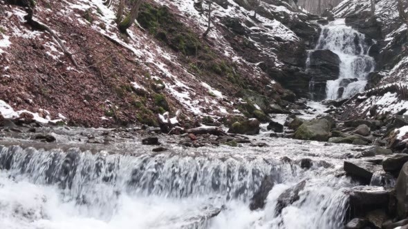 Fast Flowing Water in a Waterfall During Winter