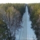 Flying Over The Forest Road. Winter - VideoHive Item for Sale