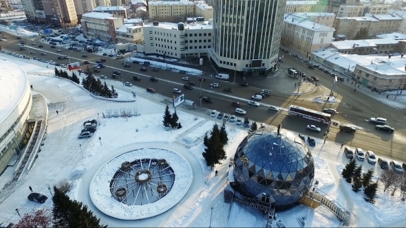 Flying Over The City Park In Winter. Spherical Building. Car Traffic