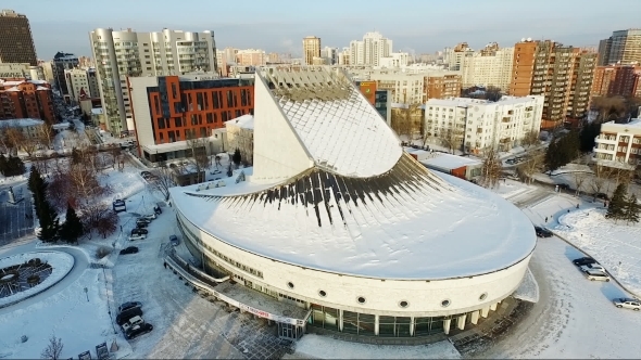 Flight Over The Theater In Winter. Flying Over The City. Architecture
