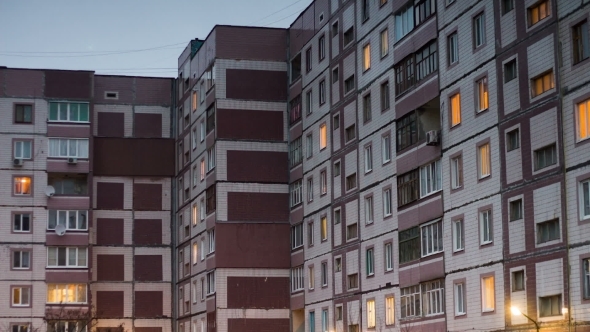 Multistorey Building With Changing Window Lighting At Night.