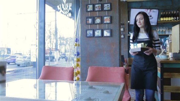 Charming Waiter In a Cafe Served Table