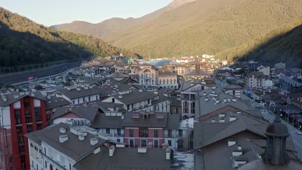 Aerial View Flight Over Premium Apartment Roofs Mountain Sunrise Shooting From Drone