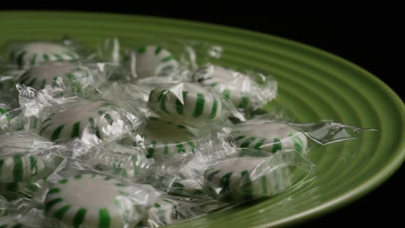 Rotating shot of spearmint hard candies - CANDY SPEARMINT 014