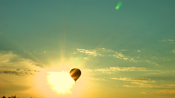 Air Balloon Cross the Sun on the Sunset
