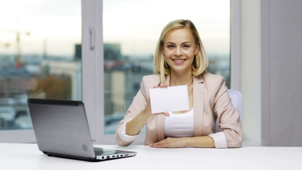 Businesswoman Showing Blank Paper Card At Office