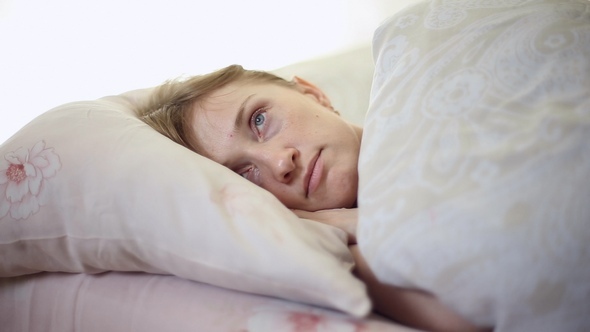 Girl Lying in Bed