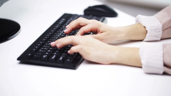 Woman Hands Typing On Computer Keyboard At Office