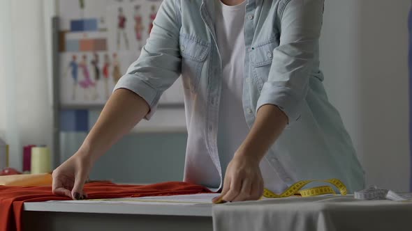 Woman Tailor Measuring Width of Sewing Dress, Working in Atelier, Creativity