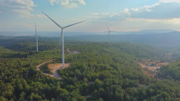 Drone Flies Over a Windmill Park