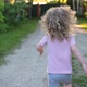 child runs forward towards adventure. A little girl runs away from the camera - VideoHive Item for Sale