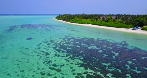 Tropical above tourism shot of a summer white paradise sand beach and aqua blue water background in 