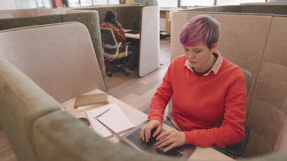 Hipster Woman Working on Laptop in Coworking Space
