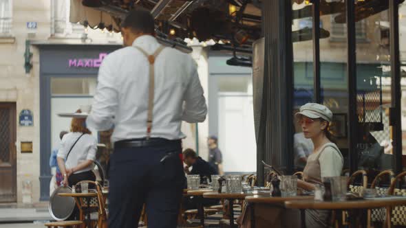 Waiter bringing food to the customer