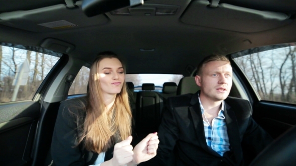 Young Couple In a Car Guy Nervous About Dancing Girl