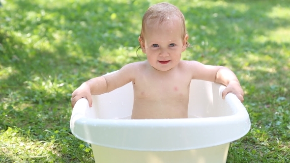 Baby Bathing In Garden