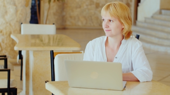 Attractive Tourist Uses Laptop