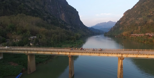 Bicycles Riding On Bridge